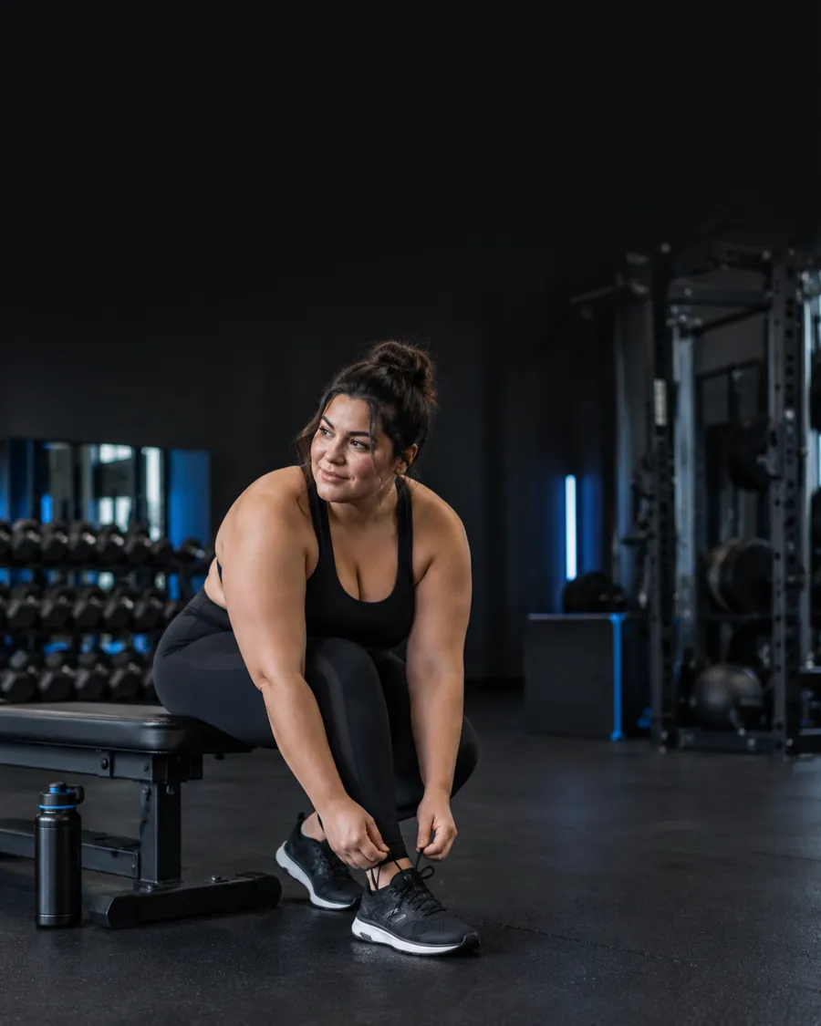 A woman preparing for a gym session